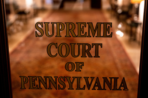 FILE - A sign on a door at The Supreme Court of Pennsylvania is pictured at the Capitol in Harrisburg, Pa., Feb. 21, 2023. (AP Photo/Matt Rourke, File)