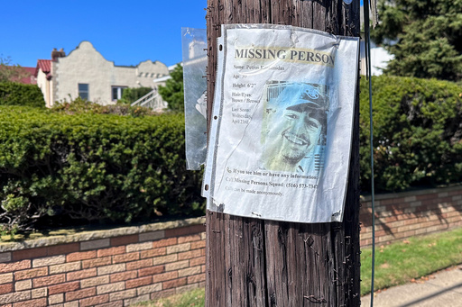 A missing person flyer for Petros Krommidas hangs on a telephone pole, Thursday, October. 9, 2025, in Long Beach, N.Y. (AP Photo/Phillip Marcelo)