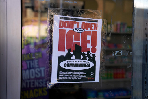 FILE - A sign regarding the U.S. Immigration and Customs Enforcement is posted on the window of a corner store on the day of President Trump's Inauguration, Jan. 20, 2025, in the predominantly Latino Little Village neighborhood Chicago. (AP Photo/Erin Hooley, File)