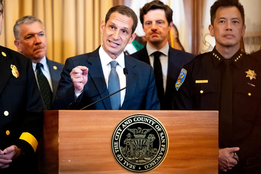 Flanked by city leaders, San Francisco Mayor Daniel Lurie discusses President Donald Trump's comments that he has called off a surge of federal law enforcement in San Francisco on Thursday, Oct. 23, 2025, in San Francisco. (AP Photo/Noah Berger)