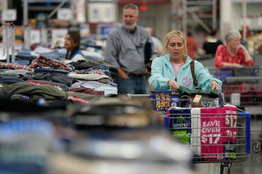 People shop for clothing at a Sam's Club, Wednesday, Sept. 24, 2025, in Bentonville, Ark. (AP Photo/Charlie Riedel)