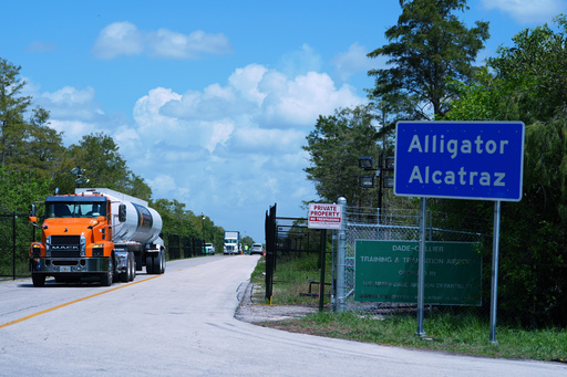 FILE - Trucks come and go from the "Alligator Alcatraz" immigration detention center in the Florida Everglades, Thursday, Aug. 28, 2025, in Collier County, Fla. (AP Photo/Rebecca Blackwell, File)