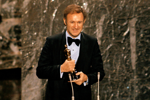 FILE - Gene Hackman accepts his Oscar for best actor at the 44th Academy Awards in Los Angeles, April 10, 1972. (AP Photo/File)