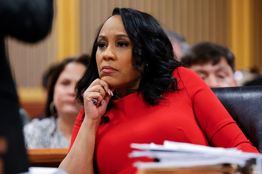 FILE - Fulton County District Attorney Fani Willis looks on during a hearing on the Georgia election interference case, Friday, March, 1, 2024, in Atlanta. (AP Photo/Alex Slitz, Pool, File)