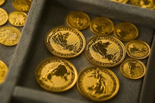 FILE - A collection of gold coins is displayed at a shop in the St. Vincent Jewelry Center in the Jewelry District of Los Angeles, April 30, 2025. (AP Photo/Jae C. Hong, file)