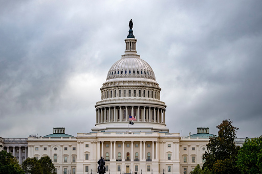The Capitol is seen under gray skies on the thirteenth day of the government shutdown, in Washington, Monday, Oct. 13, 2025. (AP Photo/J. Scott Applewhite)