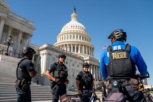 U.S. Capitol Police monitor the perimeter of the Capitol on the ninth day of the government shutdown, Thursday, Oct. 9, 2025 in Washington. (AP Photo/Allison Robbert)