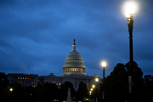 Early morning cloudy skies over the U.S. Capitol during the 8th day of the government shutdown on Wednesday, Oct. 8, 2025, in Washington. (AP Photo/John McDonnell)