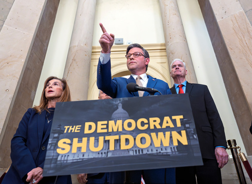Speaker of the House Mike Johnson, R-La., and GOP leaders, from left, Rep. Lisa McClain, R-Mich., and Majority Whip Tom Emmer, R-Minn., blame the government shutdown on Democrats during a news conference at the Capitol in Washington, Thursday, Oct. 2, 2025. (AP Photo/J. Scott Applewhite)