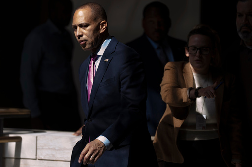 House Minority Leader Hakeem Jeffries, of N.Y., walks to a press conference on Capitol Hill on Wednesday, Oct. 1, 2025, in Washington. (AP Photo/Mark Schiefelbein)