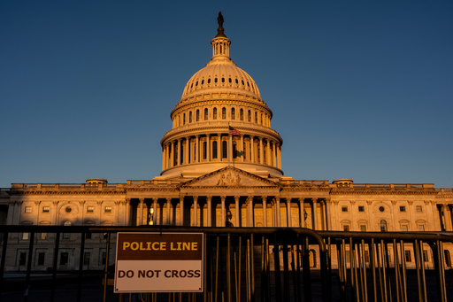 The Capitol is illuminated at dawn in Washington, Monday, Oct. 6, 2025. (AP Photo/J. Scott Applewhite)
