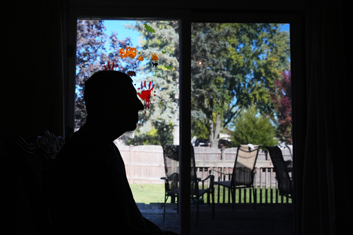 Bill Swick sits on the chair at his home in Minooka, Ill., Friday, Oct. 24, 2025. (AP Photo/Nam Y. Huh)