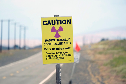 FILE - A caution sign is shown on a road on the Hanford Nuclear Reservation on June 2, 2022, in Richland, Wash. (AP Photo/Ted S. Warren, File)