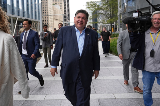 FILE - Illinois Governor JB Pritzker walks to River Point Park for a news conference, Aug. 25, 2025, in Chicago. (AP Photo/Nam Y. Huh, File)