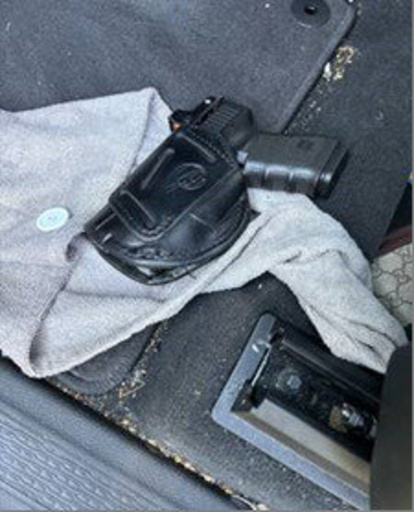 This photo provided by the U.S. Immigration and Customs Enforcement shows a loaded handgun found in the vehicle of Des Moines Public Schools Superintendent Ian Roberts on Friday, Sept. 26, 2025. (ICE via AP)