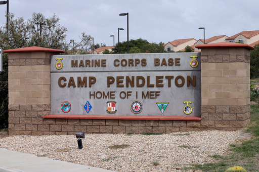 FILE - The entrance to Marine Corps base Camp Pendleton is seen on Sept. 22, 2015, in Oceanside, Calif. (AP Photo/Gregory Bull, File)
