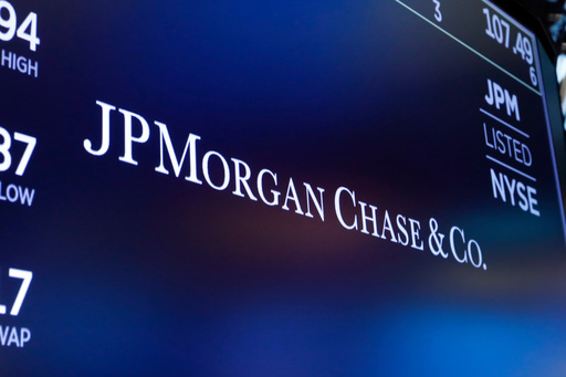 FILE - The logo for JPMorgan Chase & Co. appears above a trading post on the floor of the New York Stock Exchange in New York, Aug. 16, 2019. (AP Photo/Richard Drew, File)