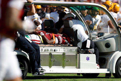 Oklahoma wide receiver Keontez Lewis, center, is carted off the field after a play against Kent State during the first half of an NCAA college football game Saturday, Oct. 4, 2025, in Norman, Okla. (AP Photo/Alonzo Adams)