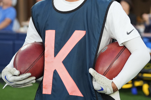 Special footballs used for kicks and punts are held by a ball crew member during the first half of an NFL football game between the Los Angeles Rams and the San Francisco 49ers, Thursday, Oct. 2, 2025, in Inglewood, Calif. (AP Photo/Marcio Jose Sanchez)
