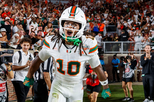 Miami wide receiver Malachi Toney (10) celebrates scoring a touchdown during the first half of an NCAA college football game, Saturday, Oct. 4, 2025, in Tallahassee, Fla. (AP Photo/Colin Hackley)