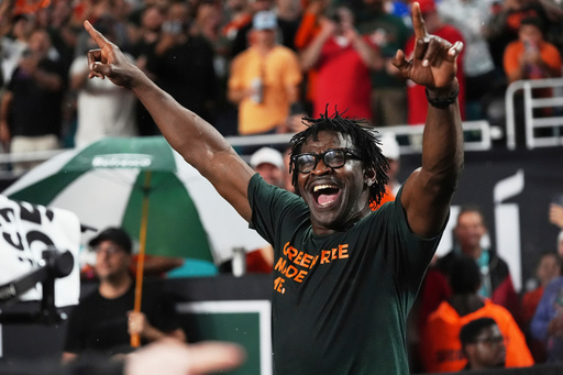 FILE - Former Miami and NFL football player Michael Irvin enters the field before an NCAA college football game between Miami and Florida, Sept. 20, 2025, in Miami Gardens, Fla. (AP Photo/Marta Lavandier)