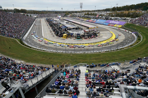 Drivers race between Turns 1 and 2 during a NASCAR Cup series auto race in Martinsville, Va., Sunday, Oct. 26, 2025. (AP Photo/Chuck Burton)