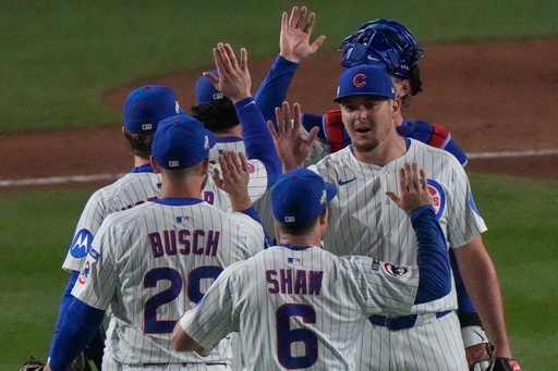 Chicago Cubs players celebrate after Game 3 of baseball's National League Division Series against the Milwaukee Brewers Wednesday, Oct. 8, 2025, in Chicago. (AP Photo/Nam Huh)