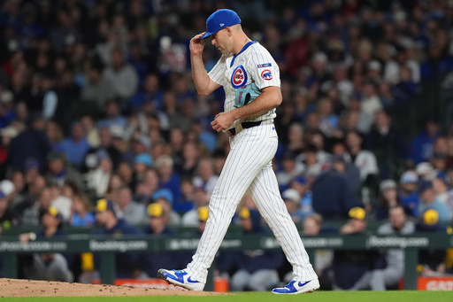 Chicago Cubs starting pitcher Matthew Boyd (16) walks to the mound during the fifth inning of Game 4 of baseball's National League Division Series against the Milwaukee Brewers Thursday, Oct. 9, 2025, in Chicago. (AP Photo/Nam Y. Huh)