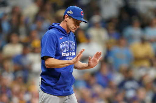 Chicago Cubs manager Craig Counsell comes to the mound to make a pitching change during the third inning of Game 2 of baseball's National League Division Series against the Milwaukee Brewers Monday, Oct. 6, 2025, in Milwaukee. (AP Photo/Kayla Wolf)