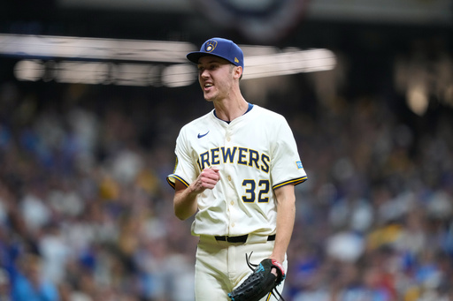 Milwaukee Brewers pitcher Jacob Misiorowski (32) reacts to an out against the Chicago Cubs during the fifth inning of Game 5 of baseball's National League Division Series, Saturday, Oct. 11, 2025, in Milwaukee. (AP Photo/Kayla Wolf)