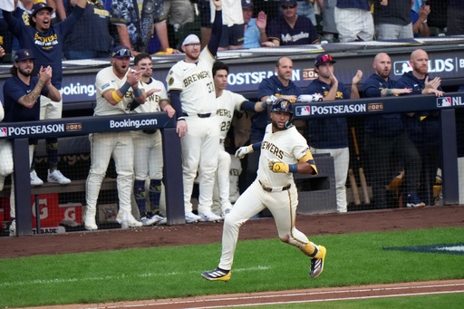 Milwaukee Brewers' Jackson Chourio hits a two-run scoring single during the first inning of Game 1 of baseball's National League Division Series against the Chicago Cubs Saturday, Oct. 4, 2025, in Milwaukee. (AP Photo/Morry Gash)
