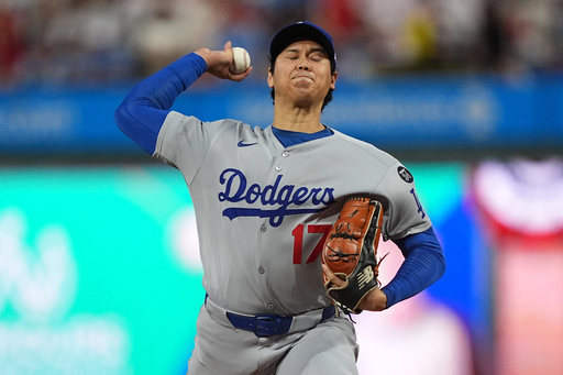 Los Angeles Dodgers' Shohei Ohtani pitches during the first inning in Game 1 of baseball's National League Division Series, Saturday, Oct. 4, 2025, in Philadelphia. (AP Photo/Matt Rourke)