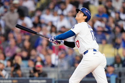 Los Angeles Dodgers' Shohei Ohtani flies out during the first inning of Game 3 of baseball's National League Division Series against the Philadelphia Phillies, Wednesday, Oct. 8, 2025, in Los Angeles. (AP Photo/Mark J. Terrill)