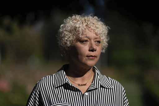 Brianna Wheeler poses for a photo at Peninsula Park, Monday, Sept. 22, 2025, in Portland, Ore. (AP Photo/Jenny Kane)