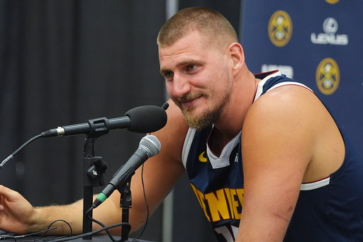 Denver Nuggets center Nikola Jokic responds to questions during an NBA basketball media day news conference Monday, Sept. 29, 2025, in Denver. (AP Photo/David Zalubowski)