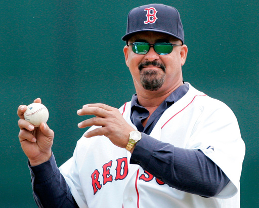 FILE - Former Boston Red Sox pluaer Mike Greenwell sets to throw out the ceremonial first pitch prior to the Red Sox-New York Mets spring training baseball game in Fort Myers, Fla., Tuesday March 11, 2008. (AP Photo/Charles Krupa, File)