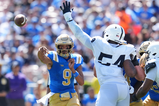 UCLA quarterback Nico Iamaleava (9) throws a pass during the first half of an NCAA college football game against Penn State, Saturday, Oct. 4, 2025, in Pasadena, Calif. (AP Photo/Marcio Jose Sanchez)