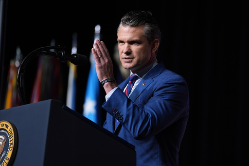Defense Secretary Pete Hegseth speaks to a gathering of top U.S. military commanders at Marine Corps Base Quantico, Tuesday, Sept. 30, 2025, in Quantico, Va. (AP Photo/Evan Vucci)