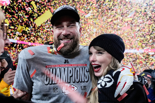 FILE - Travis Kelce, left, and Taylor Swift pose after the AFC Championship NFL football game against the Buffalo Bills, Jan. 26, 2025, in Kansas City, Mo. (AP Photo/Ashley Landis, File)