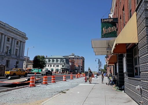 People walk by Nectar's, the music club where jam band Phish got their start, in downtown Burlington, Vt., Wednesday, July 30, 2025. (AP Photo/Amanda Swinhart)
