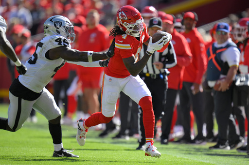Kansas City Chiefs wide receiver Rashee Rice (4) is pushed out of bounds by Las Vegas Raiders linebacker Devin White (45) during the first half of an NFL football game Sunday, Oct. 19, 2025, in Kansas City, Mo. (AP Photo/Reed Hoffmann)