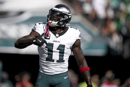 Philadelphia Eagles wide receiver A.J. Brown (11) celebrates after scoring during the second half of an NFL football game against the Los Angeles Rams Sunday, Sept. 21, 2025, in Philadelphia. (AP Photo/Matt Slocum)