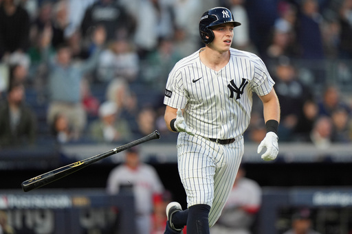 New York Yankees' Ben Rice reacts after hitting a two-run home run against the Boston Red Sox during the first inning of Game 2 of an American League wild-card baseball playoff series, Wednesday, Oct. 1, 2025, in New York. (AP Photo/Frank Franklin II)