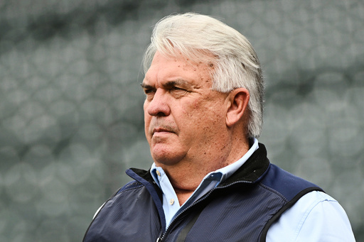 FILE - Colorado Rockies general manager Bill Schmidt watches batting practice prior to a baseball game against the Los Angeles Angels, Friday, Sept. 19, 2025, in Denver. (AP Photo/Geneva Heffernan, File)