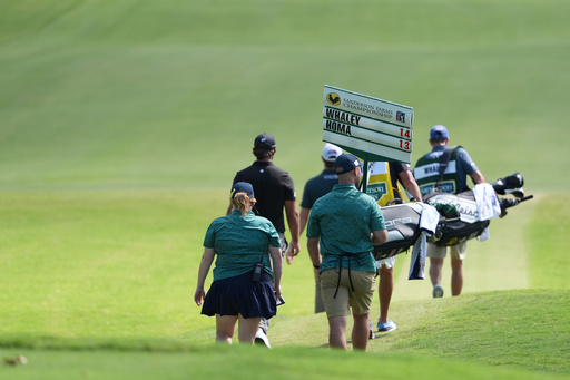 The group of Vince Whaley and Max Homa walks down the No. 1 fairway during the fourth round of the Sanderson Farms Championship golf tournament, Sunday, Oct. 5, 2025, in Jackson, Miss. (AP Photo/Rogelio V. Solis)