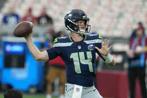 Seattle Seahawks quarterback Sam Darnold warms up before an NFL football game against the Arizona Cardinals Thursday, Sept. 25, 2025, in Glendale, Ariz. (AP Photo/Rick Scuteri)