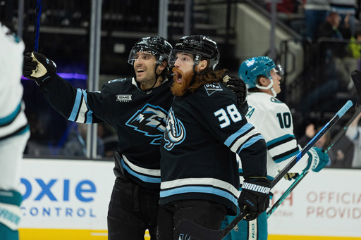 Utah Mammoth center Liam O'Brien (38) celebrates the goal with left wing Brandon Tanev (13) against San Jose Sharks during the second period of an NHL hockey game Friday, Oct. 17, 2025, in Salt Lake City. (AP Photo/Melissa Majchrzak)