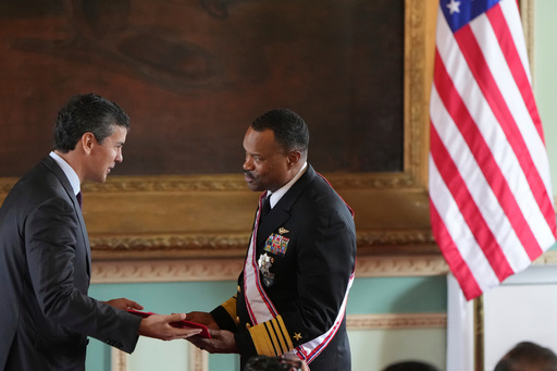 FILE - Paraguay's President Santiago Peña awards the Order of Merit "Gral Div Bernardino Caballero" in the grade of "Gran Cross", to Navy Adm. Alvin Holsey, commander of US Southern Command, at Government Palace in Asuncion, Paraguay, Aug. 23, 2025. (AP Photo/Jorge Saenz, File)