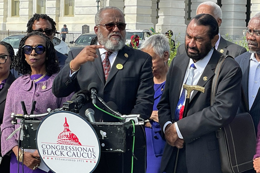 Rep. Troy Carter, D-La., and other members of the Congressional Black Caucus speak outside the U.S. Capitol after arguments were heard on the Voting Rights Act at the Supreme Court in Washington, Wednesday, Oct. 15, 2015. (AP Photo/Matt Brown)