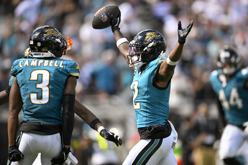 Jacksonville Jaguars cornerback Jourdan Lewis (2) reacts after intercepting a pass by Houston Texans quarterback CJ. Stroud, not visible, during the second half of an NFL football game Sunday, Sept. 21, 2025, in Jacksonville, Fla. (AP Photo/Phelan M. Ebenhack)
